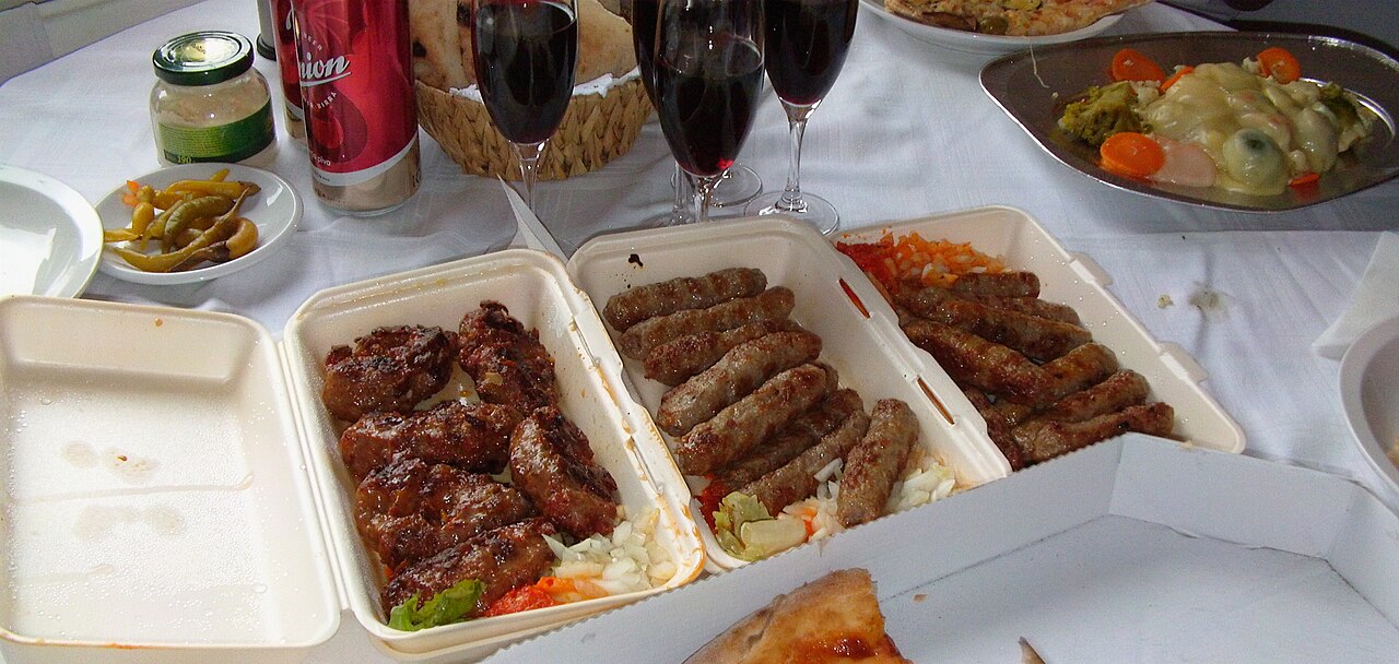Traditional Serbian cuisine with grilled meats and kajmak