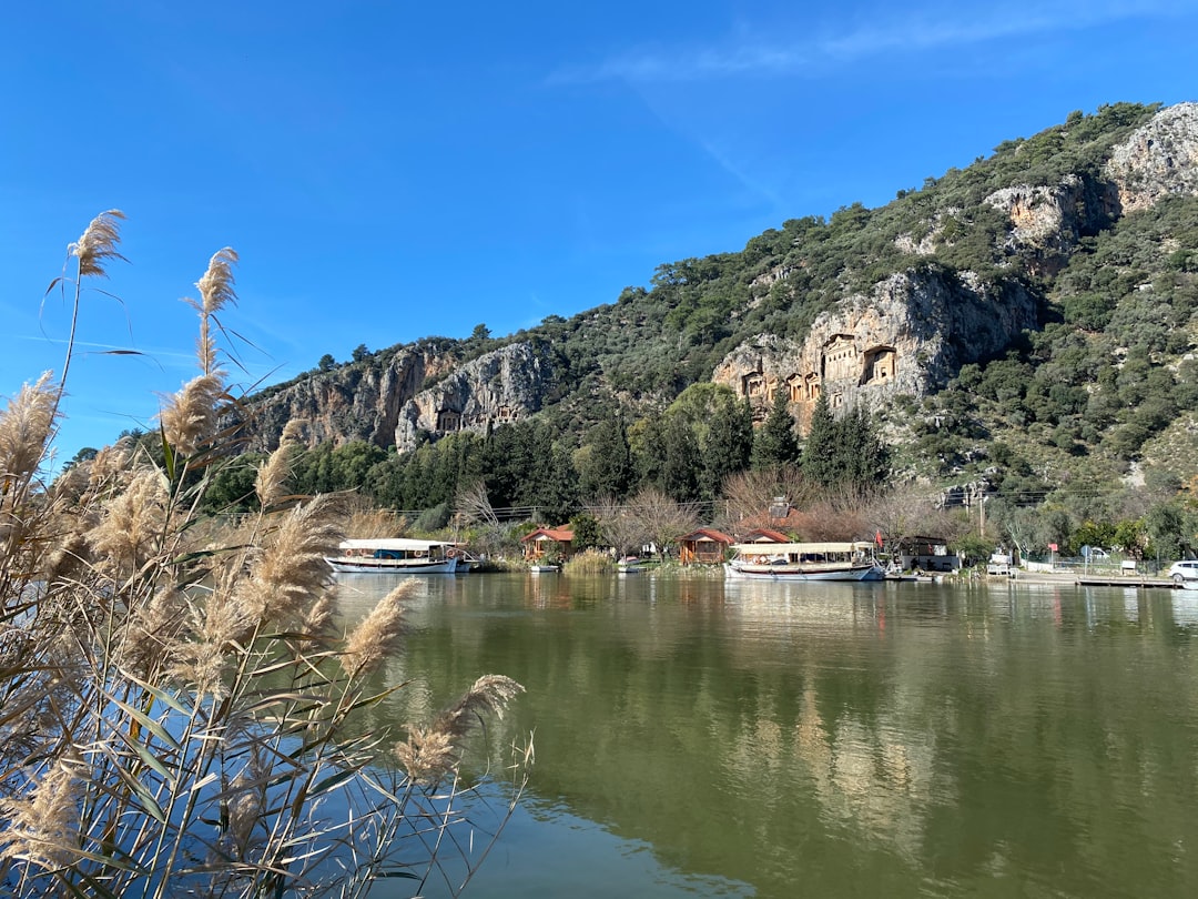 Dalyan river with ancient Lycian rock tombs carved into the cliffs of Kaunos